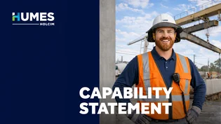 Cover of the Humes Capability Statement showing a smiling Humes worker in a hard hat and hi-vis vest at a precast yard with a gantry crane.